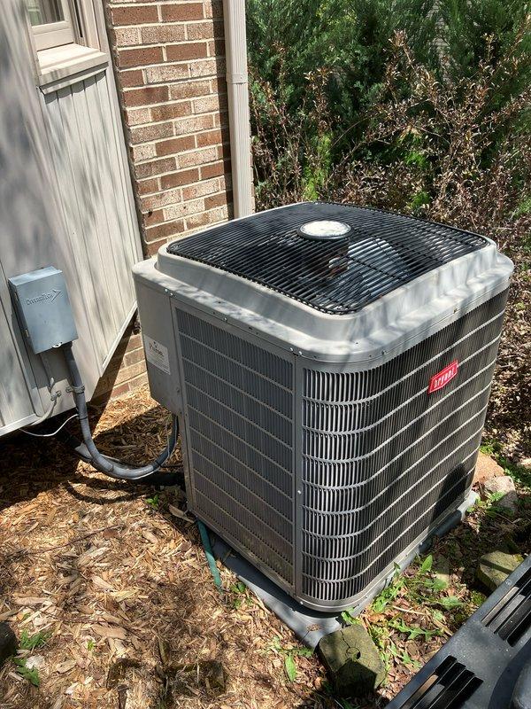 Completed comprehensive Gold AC inspection and provided replacement estimate for 16-year-old residential HVAC system with single outdoor condenser unit and basement-located air handler. System currently operational at time of inspection. Evaluated existing equipment condition, confirmed proper electrical disconnect and conduit installation at exterior unit location, and assessed condenser placement on concrete pad with adequate clearance from structure. Documented equipment specifications and site conditions through photographic records showing unit positioning adjacent to brick foundation with appropriate access for service and airflow. Provided detailed replacement proposal based on current system age, configuration, and homeowner requirements for future equipment upgrade.
