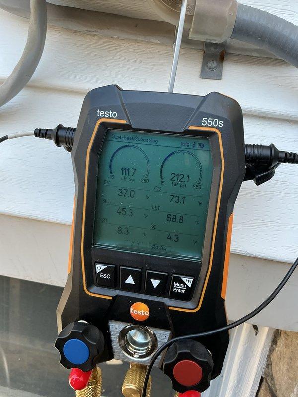 Performed commercial preventive maintenance inspection on two air conditioning systems with coils located in attic and basement areas. Conducted comprehensive system diagnostics on Bryant condenser unit using Testo 550s digital manifold gauge, recording refrigerant pressures and temperatures to verify proper system operation and charge levels. Both units found operational and functioning within manufacturer specifications at time of inspection.