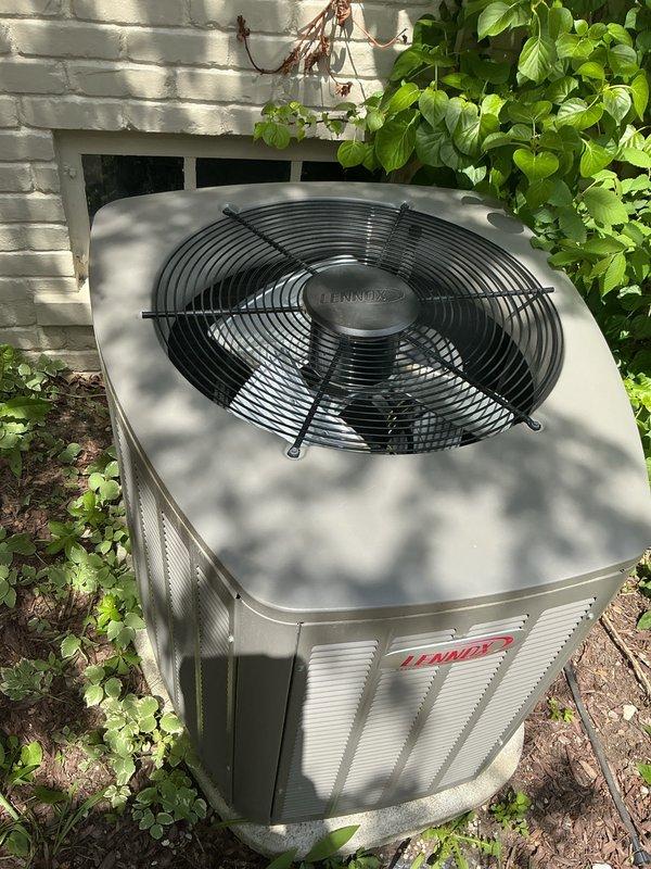 Completed comprehensive seasonal cooling maintenance and tune-up on 9-year-old Bryant residential air conditioning system. Performed full system inspection including condenser unit evaluation, verified proper operation of Lennox outdoor unit components, checked fan motor assembly and protective grille condition, inspected electrical connections, measured refrigerant levels and pressures, cleaned condenser coils, verified adequate airflow through louvers, and confirmed system cycling and temperature differential. All components found operating within manufacturer specifications with no deficiencies noted. System confirmed working properly and ready for cooling season operation.