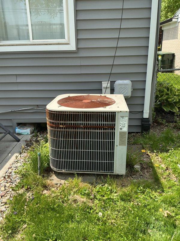 Completed comprehensive estimate for full HVAC system replacement at residential property. Assessed existing equipment including two aging outdoor condensing units (both Lennox brand, 10+ years old), furnace, and water heater, all identified for replacement due to age and customer request. Documented current system conditions through detailed site photography, noting weathering, discoloration, and general wear on exterior units positioned on concrete pads with electrical disconnects and conduit properly installed on gray vinyl siding. Provided quote for complete system upgrade to ensure efficient heating and cooling performance.