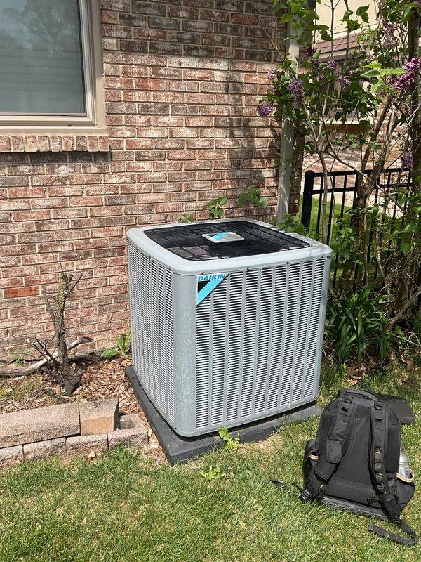 Completed preventive maintenance inspection on 4-year-old Daikin air conditioning condenser unit located at ground level and basement coil system. Performed comprehensive tune-up including inspection of outdoor condenser unit, humidifier control (Bryant analog humidity controller), thermostat operation, and hot water tank. All components inspected and verified for proper operation per manufacturer specifications.
