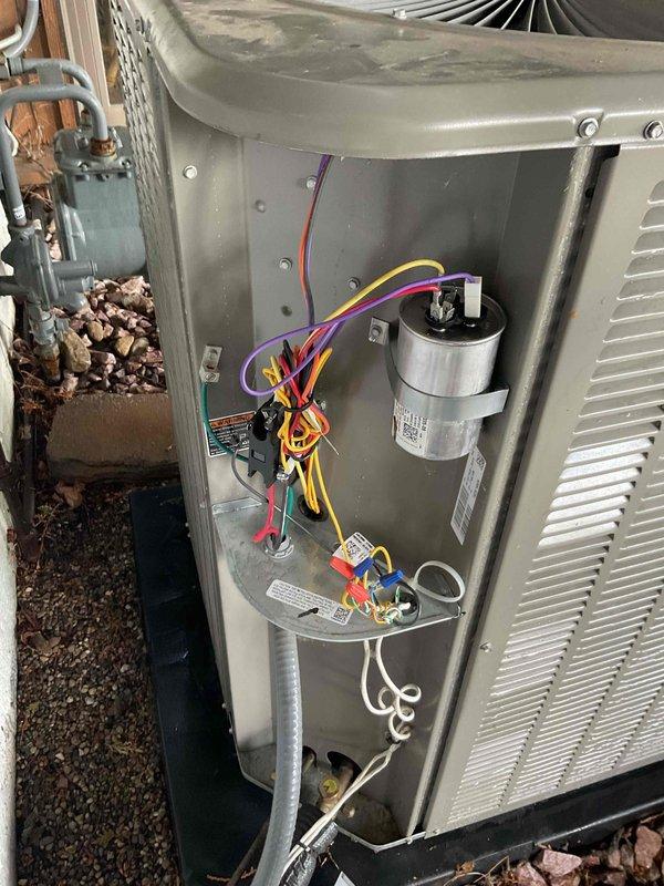 Completed comprehensive Gold AC inspection on single residential unit less than 10 years old with air handler located in attic. Performed thorough examination of outdoor condensing unit, noting significant dirt and debris accumulation on condenser coil fins requiring attention for optimal heat transfer efficiency. Inspected electrical components including capacitor, contactor assembly, and all wiring connections, confirming proper operation and secure terminations. Verified refrigerant lines, fan operation, and overall system functionality. Unit currently operating as designed with no immediate service concerns identified beyond recommended condenser coil cleaning to maintain peak performance.