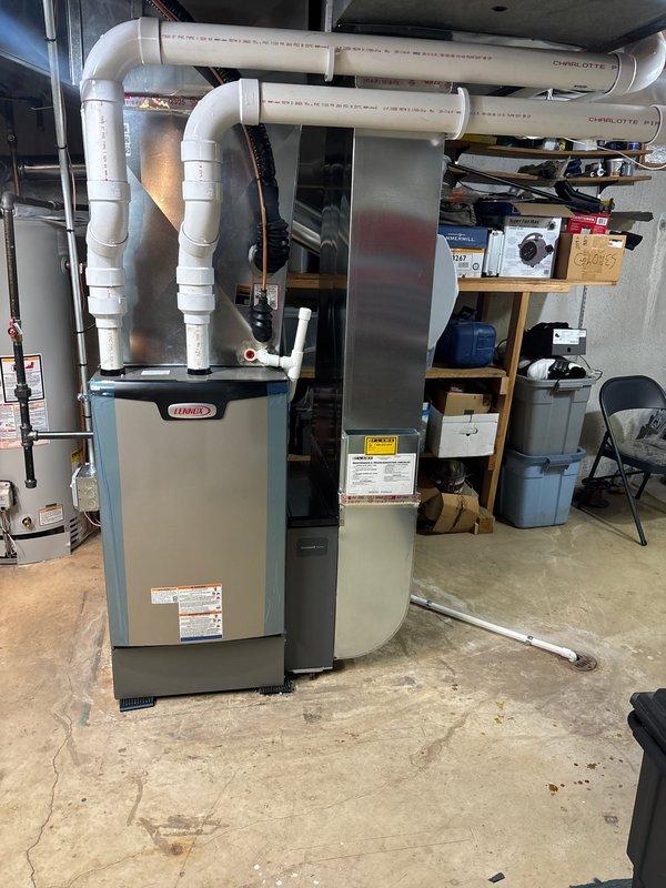 Completed full HVAC system installation including 110,000 BTU Lennox furnace and 4-ton rear-discharge air conditioning unit. Installed new humidifier on return plenum, ran white PVC venting through basement ceiling for high-efficiency furnace exhaust and intake, and coordinated electrical work for new dedicated circuit. Secured mechanical, plumbing, and electrical permits, performed remeasure of supply air ductwork, and documented AHRI certification number for utility rebate qualification with Consumers Energy and DTE.