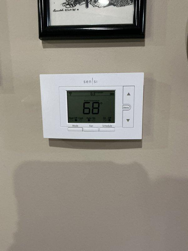 Completed comprehensive Gold AC inspection on 2019 HVAC system with air handler located in basement. Performed full system evaluation including inspection of air handler unit, thermostat functionality verification showing proper temperature reading at 68 degrees, and documentation of equipment condition. All components operating within normal parameters with no immediate service needs identified at time of inspection.