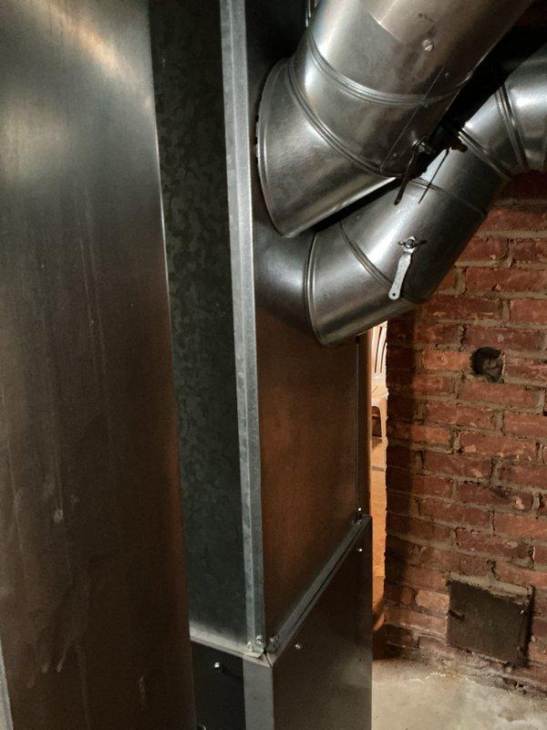 Conducted furnace replacement estimate for a 24-year-old Kenmore unit located in basement as part of city certification for rental property. Inspection revealed two significant cracks in the middle heat exchanger cell, requiring immediate attention due to safety concerns. Comprehensive evaluation included assessment of existing ductwork system, humidifier, thermostat, and hot water tank to provide complete replacement recommendations.