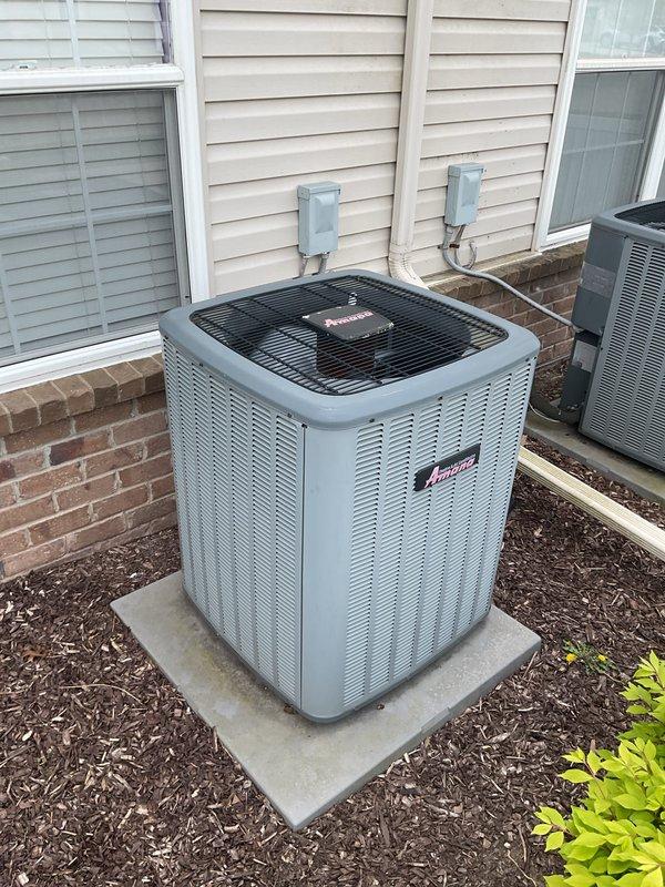 Completed Gold AC Inspection on a 12-year-old Amana central outdoor air conditioning unit located in the basement. Performed comprehensive system evaluation including visual inspection of condenser unit, refrigerant lines, electrical connections, and manufacturer specifications verification. Unit is operational with visible age-related wear on copper piping showing patina and minor label deterioration, but overall system condition remains serviceable for continued use.