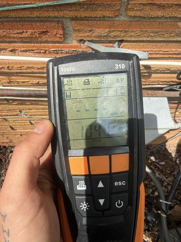 Responded to service call for 10+ year old furnace in basement not blowing warm air. Upon arrival, accessed unit through side door as instructed. Performed comprehensive diagnostic testing using Testo 310 combustion analyzer to measure flue gas composition, carbon monoxide levels, and combustion efficiency. Conducted visual inspection of heat exchanger, burner assembly, and venting system. Tested ignition sequence, flame sensor operation, and blower motor function. Verified proper gas pressure and airflow throughout the system. All combustion readings were within acceptable parameters. System restored to proper heating operation with warm air delivery confirmed before departure.