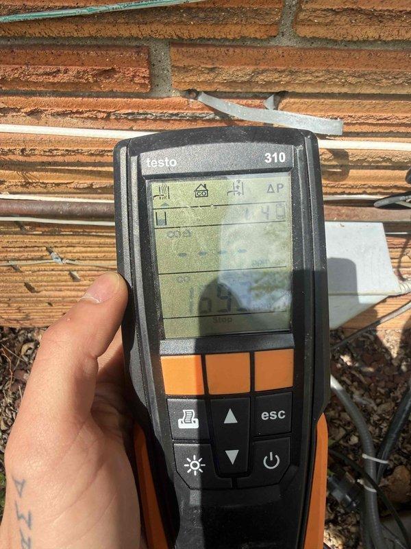 Responded to service call for 10+ year old furnace in basement not blowing warm air. Upon arrival, accessed unit through side door as instructed. Performed comprehensive diagnostic testing using Testo 310 combustion analyzer to measure flue gas composition, carbon monoxide levels, and combustion efficiency. Conducted visual inspection of heat exchanger, burner assembly, and venting system. Tested ignition sequence, flame sensor operation, and blower motor function. Verified proper gas pressure and airflow throughout the system. All combustion readings were within acceptable parameters. System restored to proper heating operation with warm air delivery confirmed before departure.
