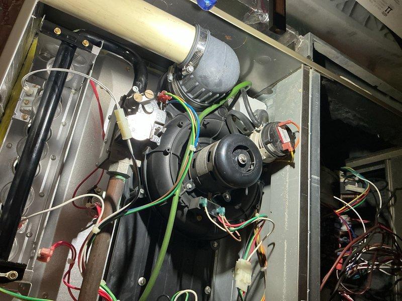 Completed comprehensive Gold AC inspection on 10+ year old system with outdoor condenser unit and basement-located air handler. Performed thorough examination of all electrical connections, motor assembly, wiring harnesses, and control components within air handler cabinet. Inspected outdoor condenser unit including fan operation, coil condition, and refrigerant lines. System currently operational with all components functioning as designed. Documented equipment condition through photographic records for maintenance history.