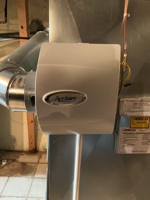 Completed Gold AC inspection on 2022 system with air handler located in basement. Verified system operational status, inspected all accessible components including ductwork, refrigerant lines, and Aprilaire humidifier installation. Advised customer to maintain clear area around outdoor condenser unit, removing any debris and animal waste to ensure proper airflow and system efficiency.