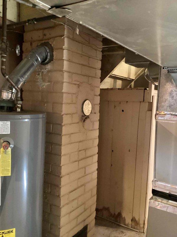 Completed estimate for air conditioning system installation at unoccupied rental property with no existing AC unit. Assessed basement mechanical room containing 2-3 year old Bryant natural gas furnace with Honeywell humidifier and existing ductwork infrastructure. Provided replacement estimate options for new central air conditioning system to integrate with current forced air heating system and utilize existing supply/return duct network.