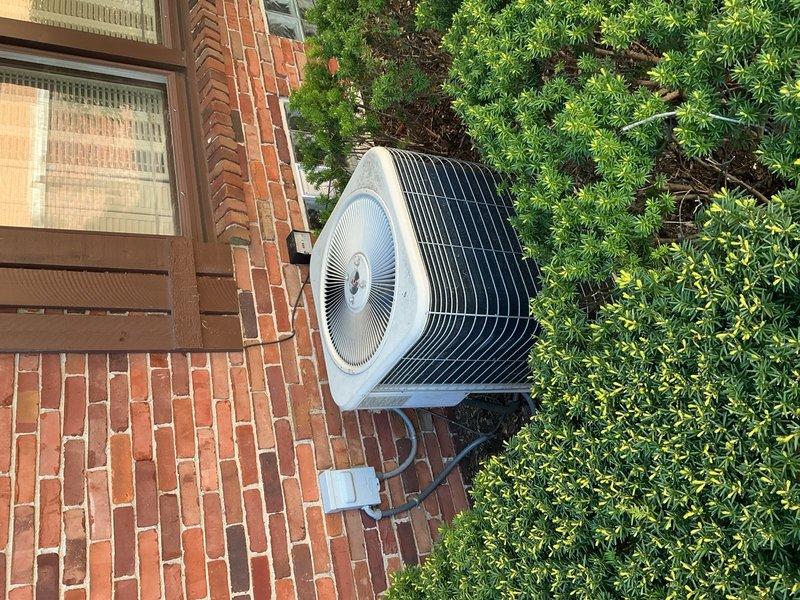 Completed comprehensive Gold AC inspection on 10+ year old residential split system with basement air handler and exterior condenser unit. Performed multi-point inspection including examination of indoor evaporator coil, refrigerant lines, condensate drainage system, electrical connections, and outdoor condensing unit. Verified proper system operation, checked refrigerant pressures, inspected condenser fins and fan assembly, confirmed adequate airflow, and assessed overall equipment condition. All components found operational with no immediate service needs identified at time of inspection.