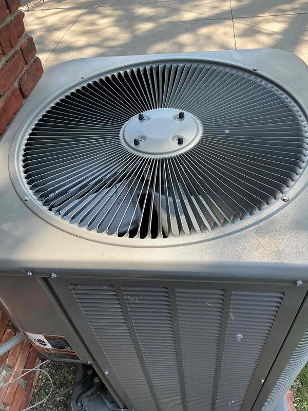 Completed comprehensive tune-up service on a 4-year-old residential air conditioning system with outdoor condenser unit and basement-located air handler. Performed standard maintenance procedures including inspection of condenser fan assembly, verification of proper airflow through louvered panels, assessment of unit housing integrity, and confirmation of secure mounting on concrete pad. System found to be in good operating condition with no significant wear, corrosion, or performance issues identified during inspection.