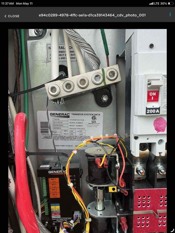 Inspected and documented Generac automatic transfer switch installation and electrical panel configuration. Replacement part has been ordered and is currently being held at the shop pending installation. System components photographed for warranty documentation, including 200A transfer switch, control module, and associated electrical connections within exterior-mounted enclosure.