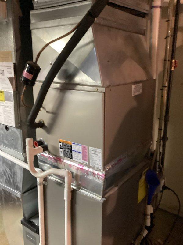 Conducted comprehensive assessment of 15-year-old residential HVAC system experiencing low refrigerant levels. Evaluated existing furnace and air handler configuration located in basement, including inspection of copper refrigerant lines, condensate drainage system, and associated electrical components. Provided equipment replacement estimate for aging system currently operational but requiring refrigerant service and showing signs of wear consistent with age.