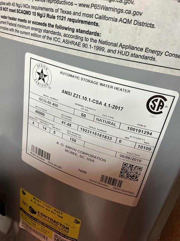 Completed comprehensive Gold AC Inspection on residential HVAC system with furnace and air conditioning units, both over 10 years old with air handler located in basement. Performed thorough visual inspection of gas furnace including burner assembly, ignition components, heat exchanger, and electrical connections. Inspected A.O. Smith 50-gallon natural gas water heater (Model GCG-50 400, manufactured June 2019) and verified compliance labeling and operational status. Documented equipment condition through photographic records showing furnace interior components, blue metallic burner assembly with flame ports, safety controls, and all manufacturer specification labels. All equipment confirmed operational at time of inspection.