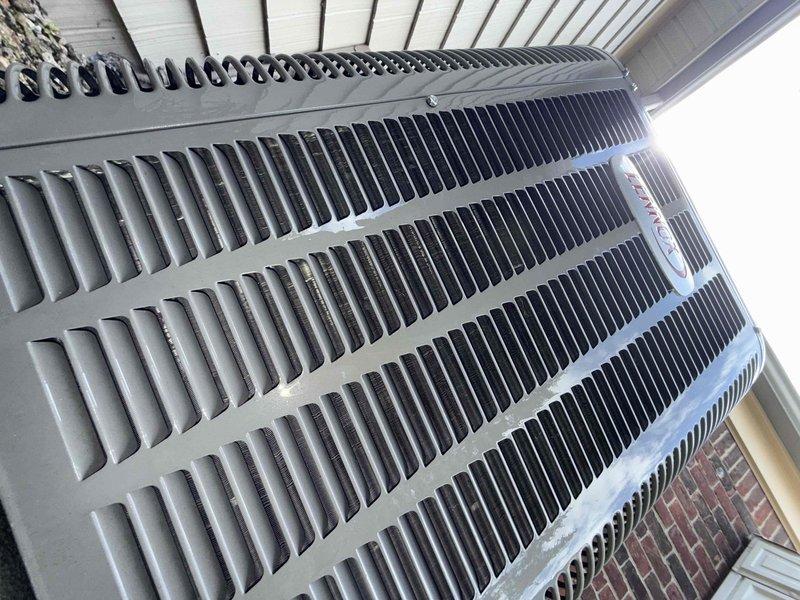 Completed comprehensive Gold Plan AC tune-up and inspection on 20-year-old Lennox condensing unit located at rear of residence. Performed full system diagnostics including refrigerant level check, electrical component testing, capacitor analysis, contactor inspection, and thermostat calibration. Cleaned condenser coils, cleared debris from unit perimeter, verified proper airflow through top-mounted fan assembly, and confirmed all safety controls functioning within manufacturer specifications. Inspected exterior cabinet condition, verified secure mounting on concrete pad, and ensured adequate clearance from surrounding structures. Unit operating efficiently with no immediate repairs required at this time; however, given the system age, recommended monitoring performance closely and considering replacement planning within the next few years to avoid unexpected failures during peak cooling season.