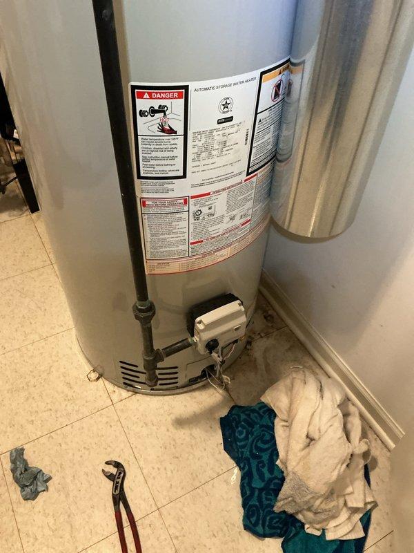 Completed mechanical installation of 50-gallon standard residential water heater including all plumbing connections, venting, and gas line hookup. Reconnected copper water supply lines, installed proper venting with galvanized ductwork, and ensured all connections meet code requirements for safe operation.