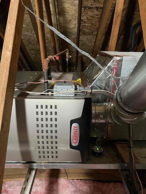Completed full-day installation of 70,000 BTU furnace system in attic space, including S40 coil, drain pan, and new supply ductwork. Installed all components on attic joists with proper support brackets, routed condensate lines and electrical connections, and completed first-floor ductwork modifications. Mechanical and electrical permits obtained, system reconnected and tested for proper operation, with utility rebate documentation submitted.