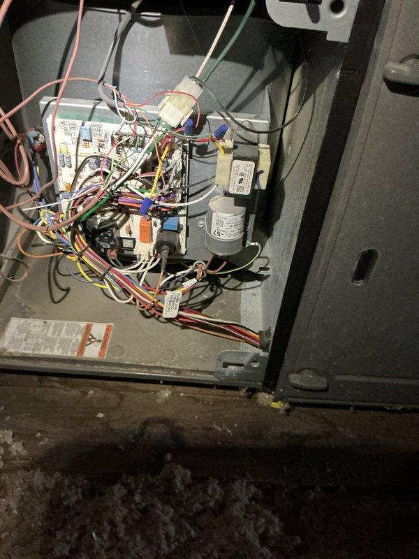 Completed scheduled maintenance inspection on commercial air conditioning system with coil-type evaporator located in basement. System was operational upon arrival. Performed comprehensive visual inspection of unit components including electrical controls, wiring connections, and capacitor. Inspected and documented air filter condition, noting standard pleated media filter with X-pattern support frame in place. Examined control panel wiring and connections, finding all wire terminations secure and properly organized. All electrical components within acceptable operating parameters. Unit remains in service with no immediate repairs required.