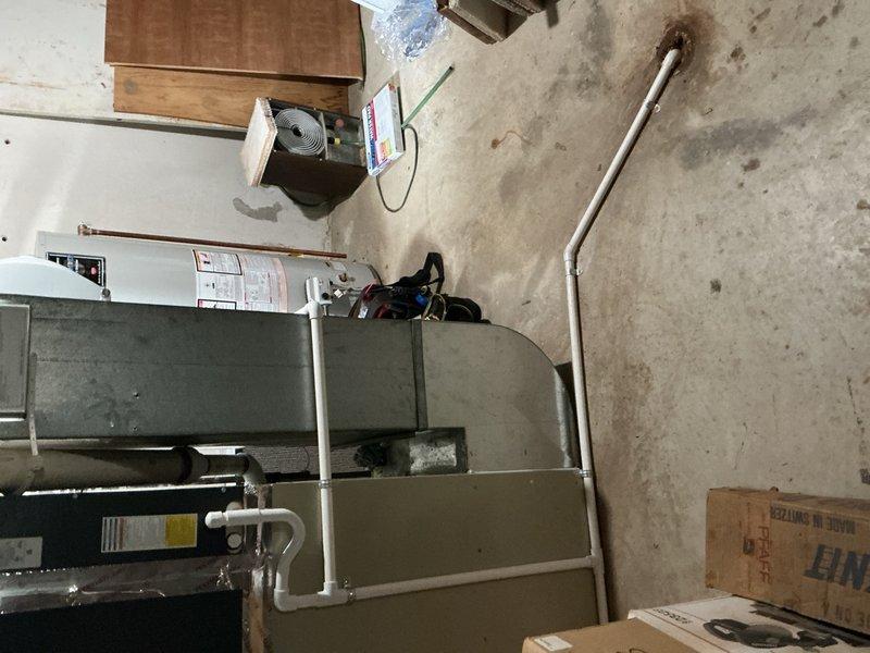 Completed comprehensive Gold AC inspection on 5-year-old single-zone residential air conditioning system with basement-located air handler. Performed thorough evaluation of indoor air handler unit, refrigerant lines, condensate drainage system, and outdoor condensing unit. System found to be in proper working condition with all components operating as designed at time of inspection.