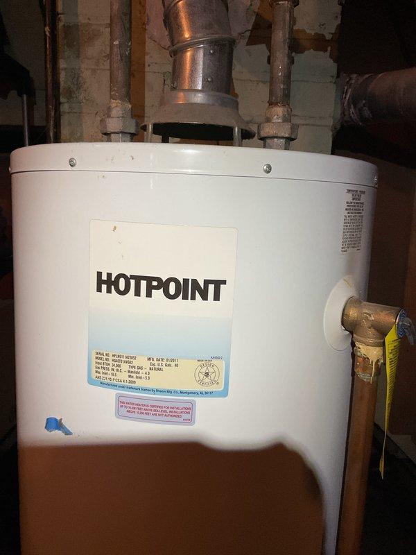 Completed comprehensive tune-up inspection on 20-year-old HVAC system located in basement. Performed thorough assessment of heating equipment, humidifier, and thermostat operation to ensure proper system functionality. Inspected air filter showing moderate dust accumulation, checked hot water tank connections and venting, and documented equipment condition with photos for city rental certification requirements.