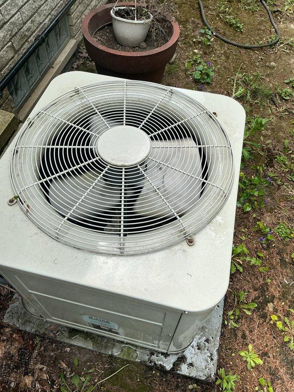 Completed comprehensive Gold AC inspection on 10+ year old residential air conditioning system with air handler located in basement. Performed thorough visual assessment of outdoor condenser unit, noting weathered but functional condition with intact fan grille and proper mounting on concrete pad. Inspected electrical connections at junction box, verifying wire terminations and component integrity. System operational at time of inspection with no immediate service requirements identified. Documentation photos captured for maintenance records.