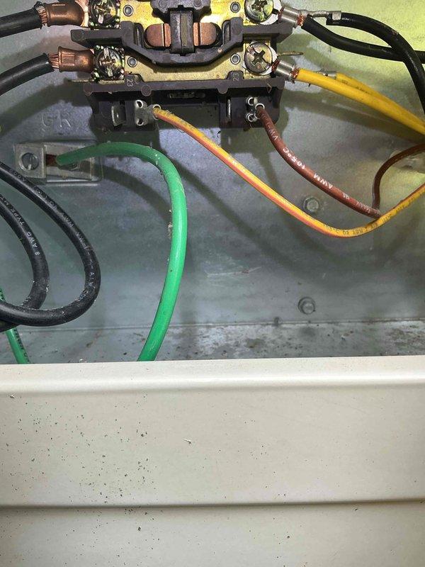 Completed comprehensive Gold AC inspection on 10+ year old residential air conditioning system with air handler located in basement. Performed thorough visual assessment of outdoor condenser unit, noting weathered but functional condition with intact fan grille and proper mounting on concrete pad. Inspected electrical connections at junction box, verifying wire terminations and component integrity. System operational at time of inspection with no immediate service requirements identified. Documentation photos captured for maintenance records.
