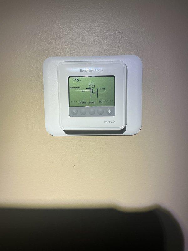Responded to service call for overheating issue with hydronic heating system serving three air handlers. Diagnosed malfunctioning boiler system unable to respond to thermostat commands, resulting in excessive heat output throughout residence. Upon inspection of 10+ year old Lochinvar boiler unit located in basement, identified failed pressure check valves preventing proper system regulation and temperature control. Thermostat displaying abnormal readings of 195% and failing to communicate effectively with boiler controls. Documented existing piping configuration including copper supply and return lines, PVC venting, expansion tank, and multiple zone valves. Ordered replacement pressure check valves for installation upon arrival at shop. System temporarily assessed pending parts delivery to restore proper thermostatic control and resolve overheating condition.