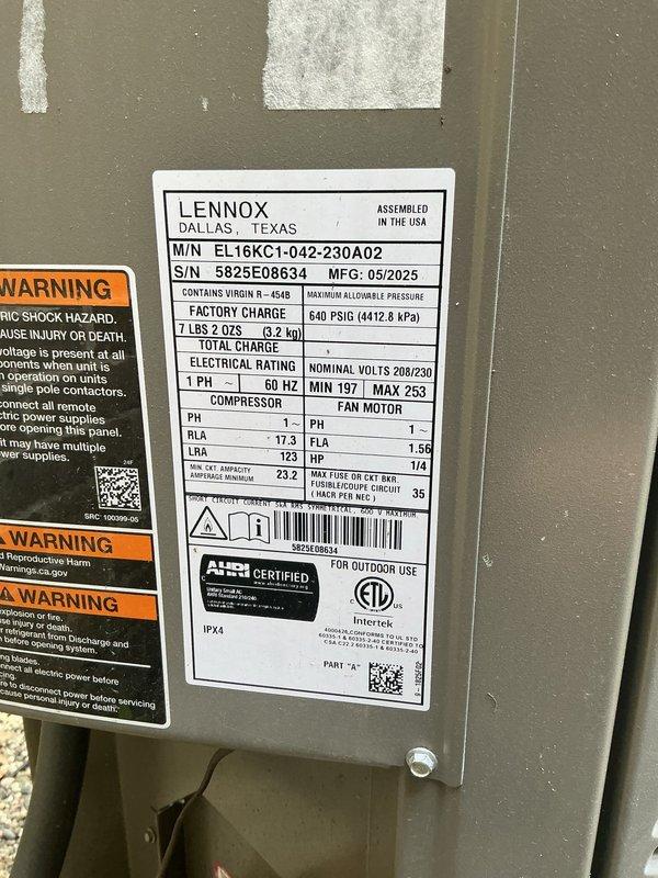 Completed air conditioning system startup for newly installed Lennox EL16KC1-042-230A02 condensing unit with R-410a refrigerant and matching indoor evaporator coil. Verified proper electrical connections at 208/230V single-phase power supply, confirmed compressor RLA of 17.3 amps and LRA of 123 amps within specifications, and tested 1/4 HP condenser fan motor operation. Inspected refrigerant line set connections between outdoor unit and basement-installed air handler, checked factory refrigerant charge, and verified system pressures. Confirmed proper condensate drainage through white PVC piping, tested all safety controls and warning labels, and validated ductwork connections to furnace plenum. System operating efficiently with all components functioning as designed.