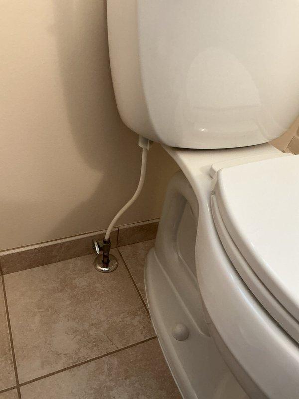 Responded to service call for toilet with flushing and slow fill issues. Upon inspection, identified malfunctioning fill valve with yellow cap and compromised flapper mechanism in Kohler toilet tank. Adjusted flush valve assembly, tested flapper seal, and verified proper chain tension on flush handle mechanism. Confirmed water supply line connection at wall-mounted shut-off valve was secure and functioning correctly. Completed operational testing to ensure proper flush cycle and tank refill rate restored to normal performance.