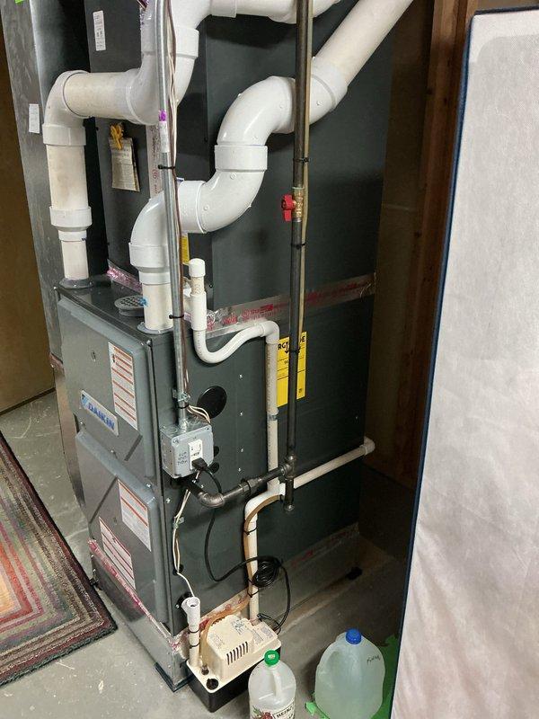 Completed preventative maintenance inspection on residential multi-zone HVAC system consisting of Daikin mini-split unit and conventional air conditioning system with furnace located in basement. Both systems are less than 10 years old and operational at time of service. Documented equipment condition through photography, verified proper operation of all components including condensate removal systems, inspected refrigerant lines and PVC drainage configuration, and confirmed all safety labels and warning stickers present on equipment.