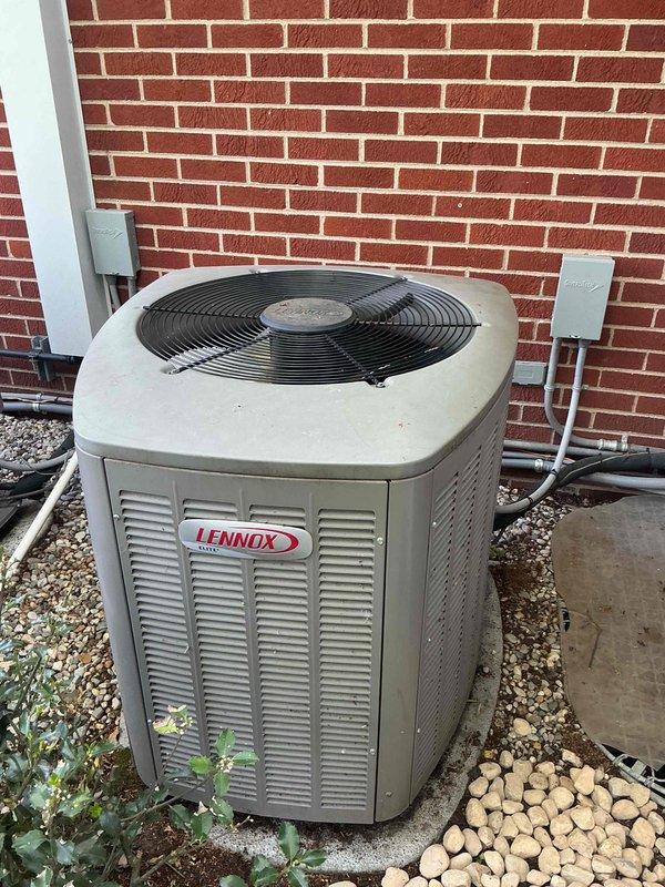 Completed comprehensive Gold AC Inspection on two residential air conditioning systems, both 10+ years old. Inspected outdoor Lennox condenser unit and secondary system, both positioned on gravel beds against building exterior. Performed thorough visual assessment of equipment condition, verified proper installation including refrigerant line connections, electrical disconnect boxes, and drainage systems. Evaluated condenser coil cleanliness, fan operation accessibility, and overall system integrity. Documented unit positioning, clearance from vegetation and landscaping elements, and concrete pad stability. Air handler/coil located in basement and outdoor locations were noted for future service reference. Both systems showed typical wear consistent with age but maintained operational readiness for continued service.