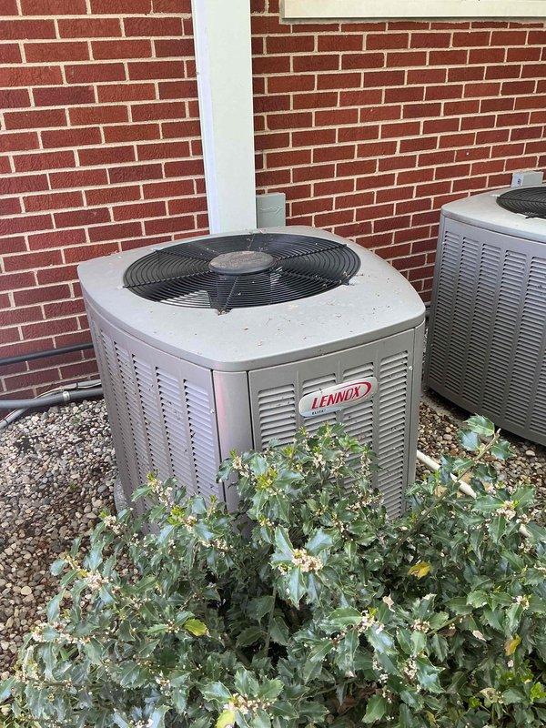 Completed comprehensive Gold AC Inspection on two residential air conditioning systems, both 10+ years old. Inspected outdoor Lennox condenser unit and secondary system, both positioned on gravel beds against building exterior. Performed thorough visual assessment of equipment condition, verified proper installation including refrigerant line connections, electrical disconnect boxes, and drainage systems. Evaluated condenser coil cleanliness, fan operation accessibility, and overall system integrity. Documented unit positioning, clearance from vegetation and landscaping elements, and concrete pad stability. Air handler/coil located in basement and outdoor locations were noted for future service reference. Both systems showed typical wear consistent with age but maintained operational readiness for continued service.