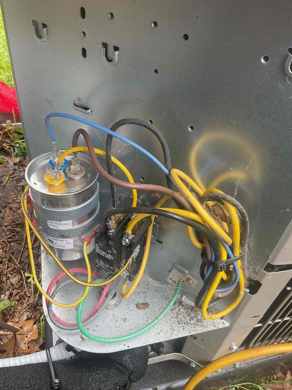 Completed comprehensive five-year furnace inspection in basement and evaluated outdoor Bryant air conditioning condenser unit as part of prepaid maintenance visit. Inspected electrical components including capacitor, contactor, and associated wiring connections within outdoor unit, documenting condition of all terminals and electrical pathways. Verified outdoor condenser placement on pad, assessed unit cleanliness, and confirmed proper clearance from surrounding vegetation and debris.