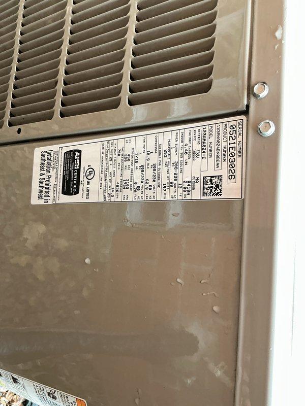 Completed comprehensive Gold AC inspection on 4-year-old residential air conditioning system with basement-located air handler and evaporator coil. Performed thorough evaluation of outdoor condensing unit, verifying proper operation of all electrical components including disconnect switch and safety controls. Inspected indoor air handler and evaporator coil assembly, checking refrigerant levels, electrical connections, and overall system performance. Documented equipment condition through photographic evidence showing exterior condensing unit with weathered cabinet finish consistent with outdoor exposure and age, along with properly installed electrical disconnect box mounted on exterior brick wall with appropriate safety labeling and conduit connections. System confirmed operational at time of inspection with all components functioning within normal parameters.