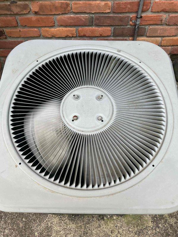 Completed comprehensive Gold AC inspection on a two-unit residential HVAC system with equipment over 10 years old. Performed thorough evaluation of Lennox outdoor condenser unit, including inspection of fan assembly, protective wire guard, and top-discharge configuration. Verified proper operation of both units, with air handler/coil located in attic and secondary unit in basement. Inspected condenser mounting, confirmed adequate clearance around unit, and assessed overall equipment condition. All systems verified operational at time of inspection.