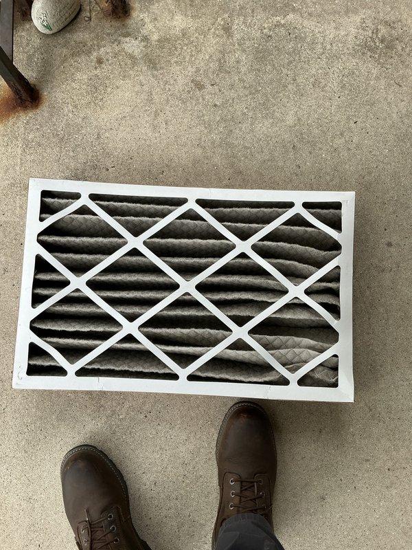 Responded to no heat call for 3-year-old furnace system located in basement. Upon arrival, performed diagnostic inspection of heating system. Found heavily soiled air filter restricting airflow to unit. Removed and inspected filter, which showed significant dust and debris accumulation causing reduced system performance and potential safety limit tripping. Replaced dirty filter with new unit to restore proper airflow. Inspected supply duct system and verified proper operation. Tested furnace operation through complete heating cycle. System fired successfully and reached temperature setpoint. Confirmed adequate airflow at registers and proper system function before departure.