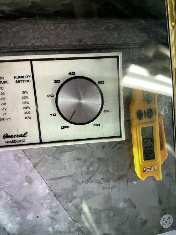 Completed comprehensive AC inspection on less than one-year-old unit located in basement. Performed thorough examination of outdoor condenser unit, General brand humidistat control system with temperature-humidity correlation settings, thermostat operation, and hot water tank. All components inspected and found to be functioning within normal parameters, with system properly maintained and operational.