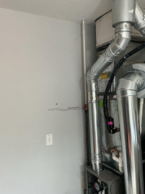 Completed installation of 70,000 BTU furnace system in interior utility space with all associated ductwork, electrical connections, and humidifier integration. Secured mechanical and electrical permits, established proper refrigerant line routing, connected all supply and return ductwork with appropriate sealing, and verified electrical panel compatibility and circuit protection. System tested and operational upon completion.