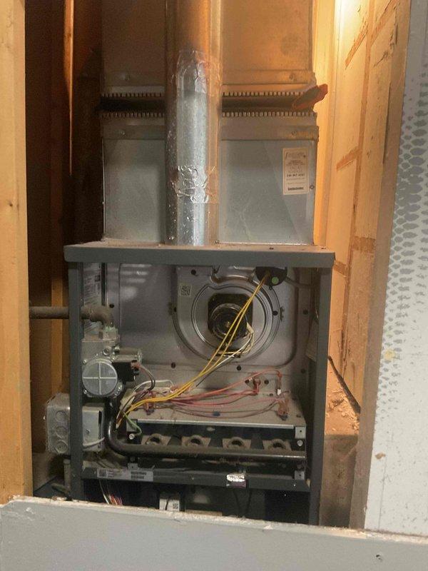 Completed routine tune-up maintenance on a 5-year-old furnace located on the main level. Performed comprehensive inspection of all system components including gas valve, burner assembly, blower motor, and electrical connections. Verified proper ignition sequence and observed blue flame pattern across all burners, confirming optimal combustion. Inspected heat exchanger, flue pipe, and venting system for proper operation. Checked and tested all safety controls and electrical wiring connections. System operating within manufacturer specifications with no issues found.