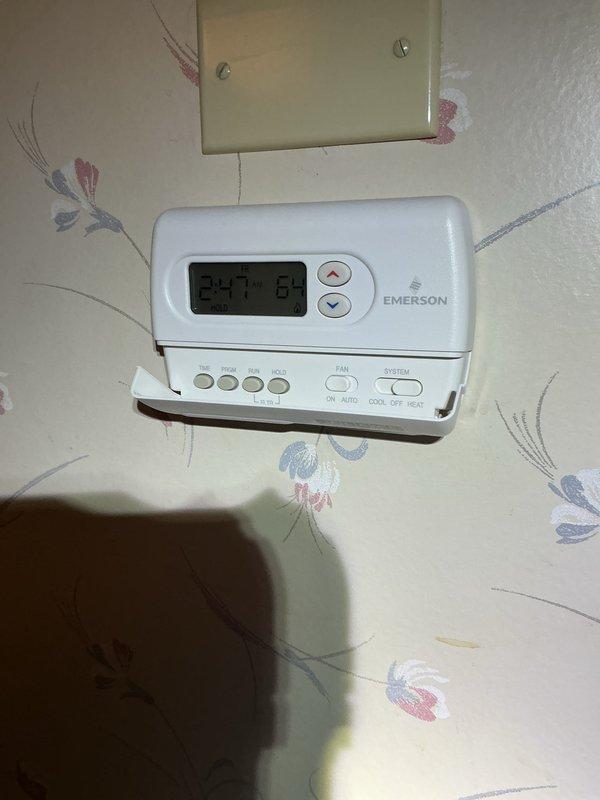 Completed comprehensive Gold AC Inspection on a 3-year-old single air conditioning system with air handler located in basement. Performed full system evaluation including visual inspection of equipment, thermostat functionality check, and documentation of unit condition. Verified system operational status, confirmed proper thermostat programming and display function showing 64°F setpoint, and assessed overall equipment performance. All components found operating within normal parameters with no immediate service needs identified.