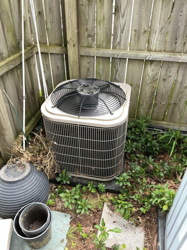 Completed comprehensive Gold AC inspection on 5-year-old Daikin condensing unit with air handler located on main floor near laundry area. Performed full system evaluation including visual inspection of outdoor condenser unit, verified operational status of fan assembly, checked electrical disconnect, and assessed overall equipment condition. Advised customer that vegetation and debris surrounding condenser base should be cleared for optimal airflow and efficiency, and recommended removing animal waste from area to prevent potential system damage and maintain proper operation.