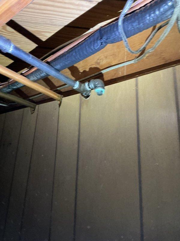 Responded to service call for gas line capping in residential basement. Located existing black iron gas supply line with yellow shut-off valve in utility area near exposed brick wall. Successfully capped off the gas line per customer request to ensure safe disconnection of unused gas supply. Verified proper shut-off valve operation and confirmed no active gas flow to the terminated line. Installation completed in accordance with local gas fitting codes and safety standards.