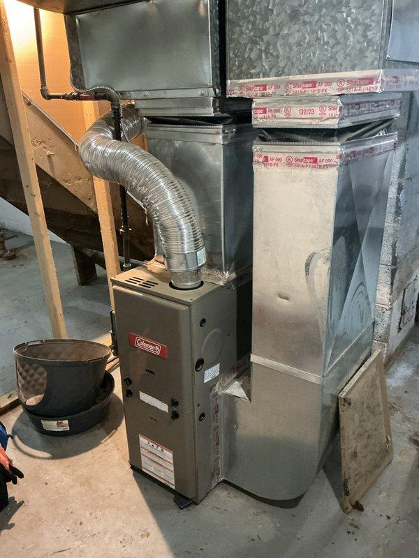 Completed city certification tune-up on Coleman furnace unit located in basement. Performed comprehensive inspection of heating system including burner assembly, heat exchanger, blower motor, and all safety controls. Verified proper operation of thermostat set to 69 degrees, checked electrical connections, tested ignition sequence, and confirmed adequate airflow through ductwork. All components found operating within manufacturer specifications and system passed certification requirements.