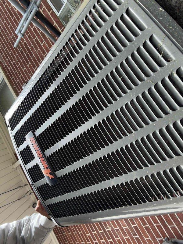 Completed comprehensive Gold AC Inspection on 28-year-old residential air conditioning system with air handler located in basement. Performed thorough examination of outdoor condenser unit, inspecting condenser coils for cleanliness and proper airflow, verified all cooling fins were intact and free of debris accumulation. Examined condenser housing, protective grille, and heat exchange coil system, confirming unit operational status and overall condition satisfactory for age of equipment.