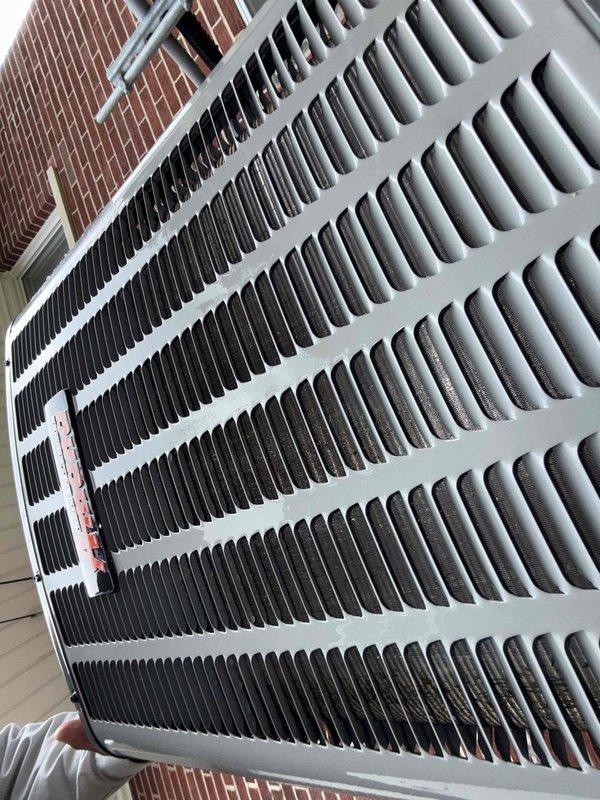 Completed comprehensive Gold AC Inspection on 28-year-old residential air conditioning system with air handler located in basement. Performed thorough examination of outdoor condenser unit, inspecting condenser coils for cleanliness and proper airflow, verified all cooling fins were intact and free of debris accumulation. Examined condenser housing, protective grille, and heat exchange coil system, confirming unit operational status and overall condition satisfactory for age of equipment.