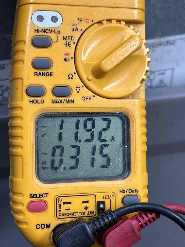 Completed comprehensive Gold AC inspection on 10+ year old system with air handler located in basement. Performed electrical diagnostics using digital multimeter to measure amperage draw and verify proper system operation, recording readings of 11.92A and 0.290A on various components. Advised customer that condenser area requires clearing of debris and animal waste to maintain proper airflow and system efficiency.