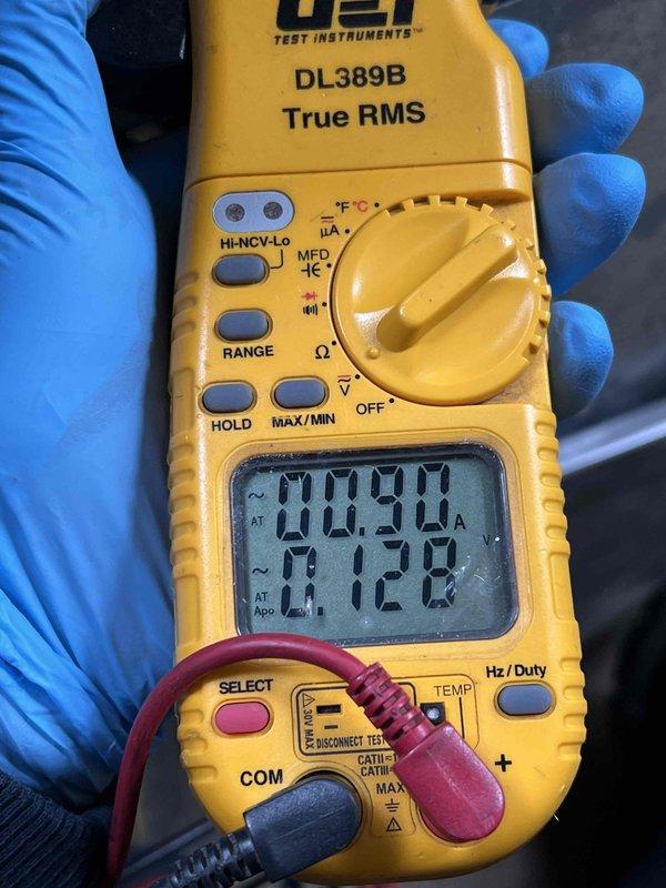 Completed comprehensive Gold AC inspection on 10+ year old system with air handler located in basement. Performed electrical diagnostics using digital multimeter to measure amperage draw and verify proper system operation, recording readings of 11.92A and 0.290A on various components. Advised customer that condenser area requires clearing of debris and animal waste to maintain proper airflow and system efficiency.