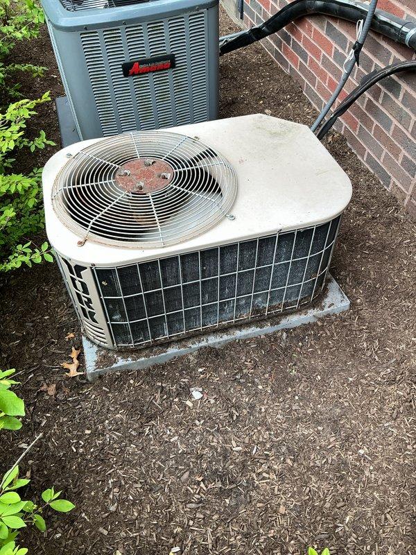 Completed comprehensive spring maintenance inspection on three residential air conditioning systems: one 1-year-old unit and two 15-year-old units located in basement and attic spaces. Performed Gold AC Tune-Up protocol on all three systems, including filter inspection, refrigerant level verification, electrical connection testing, condenser coil cleaning, fan motor lubrication, and thermostat calibration. All outdoor condensing units inspected and photographed, with older units showing normal wear consistent with 15 years of operation but maintaining operational integrity. Systems tested and confirmed operational for cooling season.